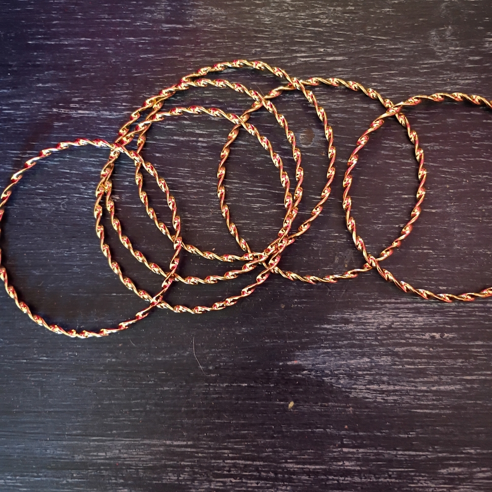 Elegant Gold and Black Twisted Bangles